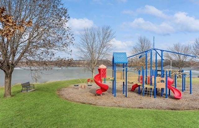community playground featuring a yard and a water view