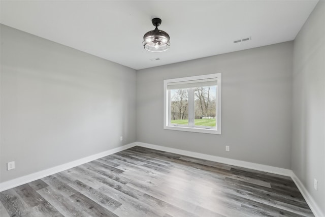 875 Roman Rd, Waukee, IA 50263 - empty room with wood finished floors and baseboards