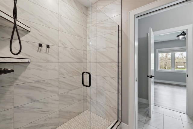 875 Roman Rd, Waukee, IA 50263 - full bathroom featuring a shower stall, baseboards, and tile patterned floors