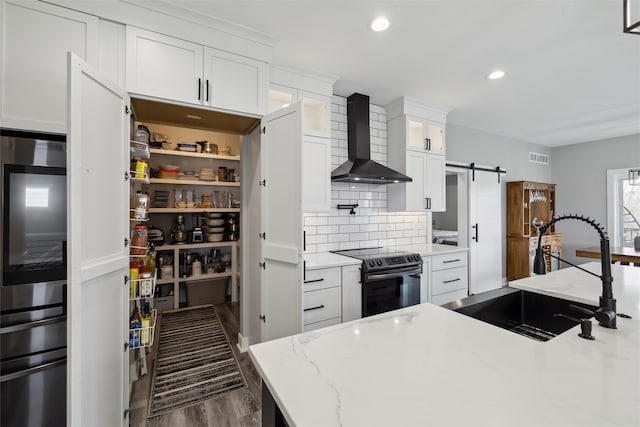 875 Roman Rd, Waukee, IA 50263 - kitchen featuring electric stove, wall chimney range hood, a sink, dark wood-style floors, and white cabinetry