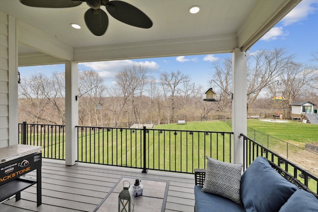 875 Roman Rd, Waukee, IA 50263 - deck featuring a ceiling fan and a lawn
