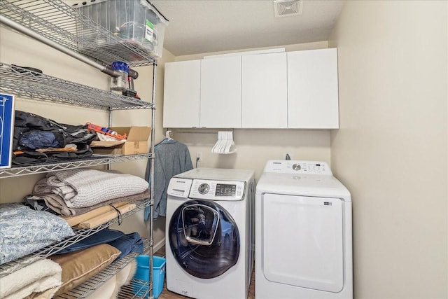 5417 NW 92nd St, Johnston, IA 50131 - washroom with cabinet space and washer and dryer