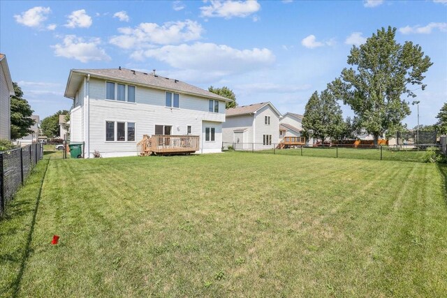 5417 NW 92nd St, Johnston, IA 50131 - rear view of house featuring a fenced backyard and a deck