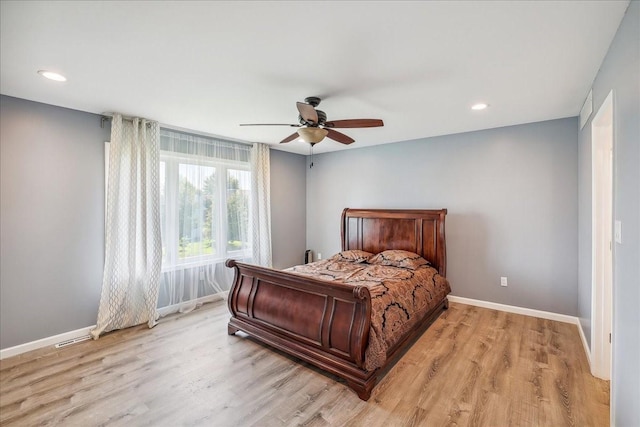 5417 NW 92nd St, Johnston, IA 50131 - bedroom with light wood-style flooring, recessed lighting, and a ceiling fan