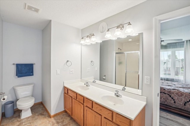 5417 NW 92nd St, Johnston, IA 50131 - ensuite bathroom featuring a shower stall, double vanity, and a textured ceiling
