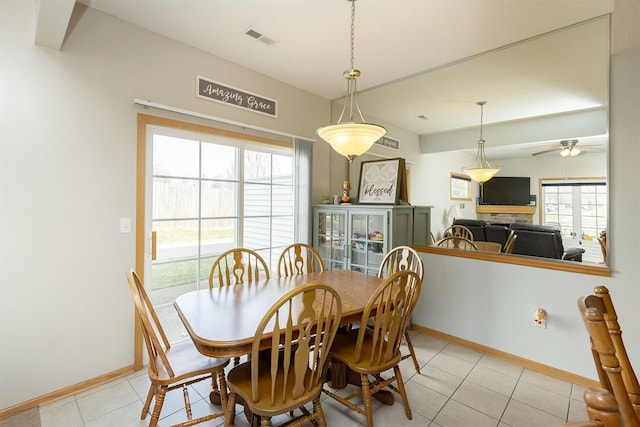 921 10th St SE, Altoona, IA 50009 - dining room featuring a ceiling fan and light tile patterned flooring