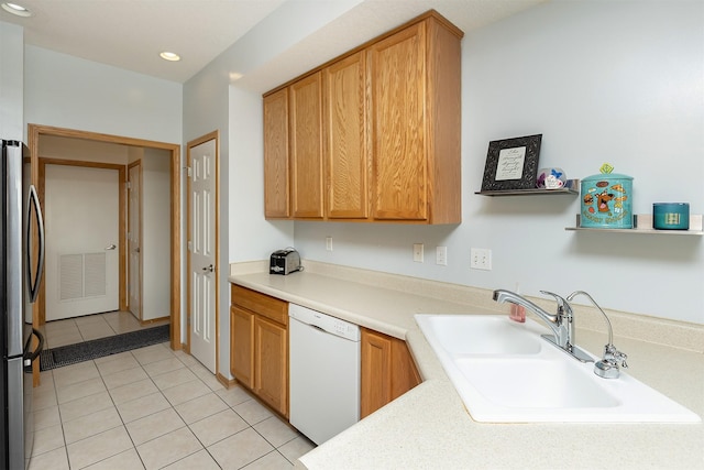 921 10th St SE, Altoona, IA 50009 - kitchen with white dishwasher, freestanding refrigerator, light tile patterned floors, light countertops, and recessed lighting