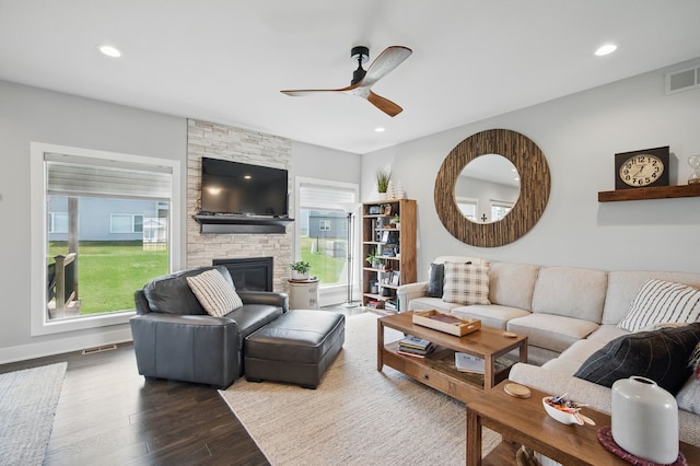 8704 Highland Oaks Dr, Johnston, IA 50131 - living area with a ceiling fan, healthy amount of natural light, dark wood finished floors, a fireplace, and recessed lighting
