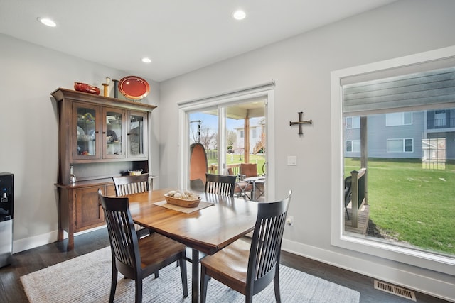 8704 Highland Oaks Dr, Johnston, IA 50131 - dining room with baseboards, dark wood-style flooring, and recessed lighting