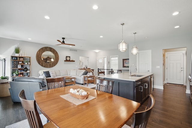8704 Highland Oaks Dr, Johnston, IA 50131 - dining room featuring dark wood-style floors, ceiling fan, recessed lighting, and baseboards