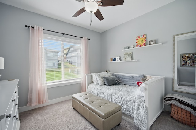 8704 Highland Oaks Dr, Johnston, IA 50131 - bedroom featuring light colored carpet, baseboards, and a ceiling fan