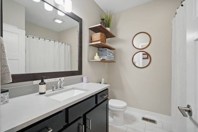 8704 Highland Oaks Dr, Johnston, IA 50131 - bathroom featuring marble look tiles, toilet, vanity, and baseboards