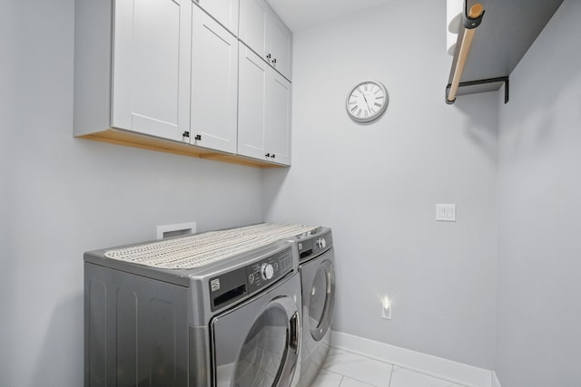 8704 Highland Oaks Dr, Johnston, IA 50131 - laundry room with washer and clothes dryer, cabinet space, and baseboards