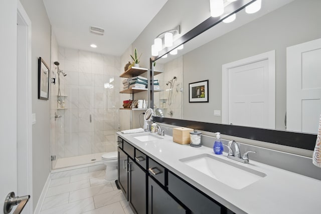 8704 Highland Oaks Dr, Johnston, IA 50131 - full bath featuring marble look tiles, a stall shower, double vanity, and toilet