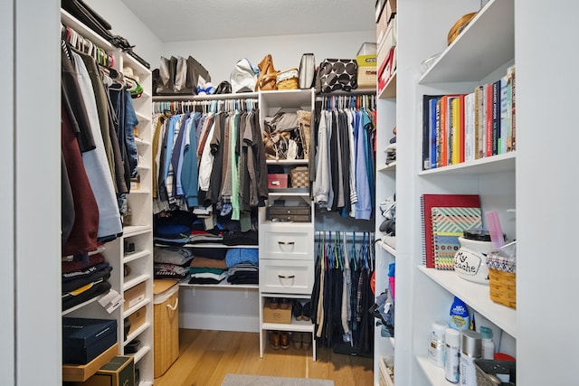 8704 Highland Oaks Dr, Johnston, IA 50131 - walk in closet with wood finished floors