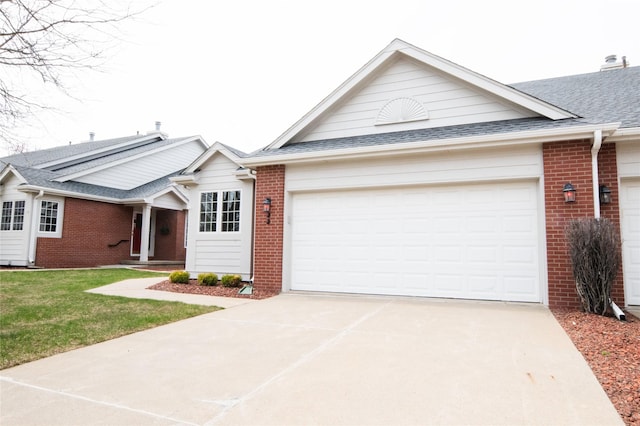 5925 Ep True Pkwy Unit 22, West Des Moines, IA 50266 - ranch-style home with brick siding, an attached garage, concrete driveway, and roof with shingles