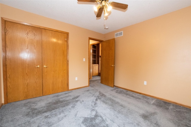5925 Ep True Pkwy Unit 22, West Des Moines, IA 50266 - unfurnished bedroom featuring a closet, carpet flooring, baseboards, and a ceiling fan