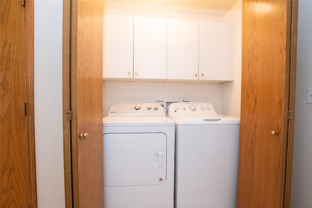 5925 Ep True Pkwy Unit 22, West Des Moines, IA 50266 - washroom with cabinet space and washing machine and dryer