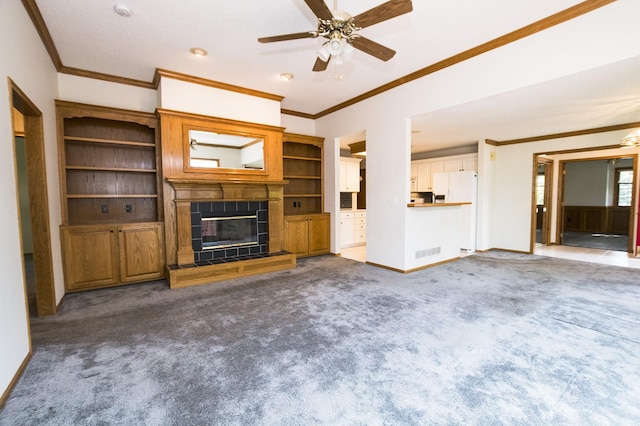 5925 Ep True Pkwy Unit 22, West Des Moines, IA 50266 - unfurnished living room featuring carpet, ornamental molding, a ceiling fan, a tile fireplace, and baseboards