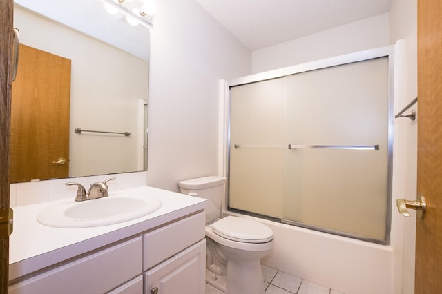 5925 Ep True Pkwy Unit 22, West Des Moines, IA 50266 - full bath featuring vanity, toilet, tile patterned floors, and bath / shower combo with glass door