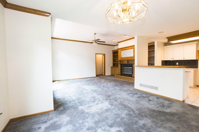 5925 Ep True Pkwy Unit 22, West Des Moines, IA 50266 - unfurnished living room featuring a fireplace, light carpet, ceiling fan, baseboards, and crown molding