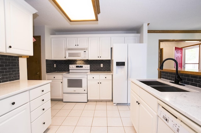 5925 Ep True Pkwy Unit 22, West Des Moines, IA 50266 - kitchen featuring white appliances, a sink, backsplash, light countertops, and crown molding