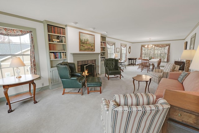 1113 Bruce Ln, Pella, IA 50219 - carpeted living area with crown molding, a fireplace, a chandelier, baseboards, and built in shelves