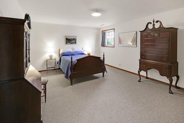 1113 Bruce Ln, Pella, IA 50219 - bedroom with baseboards and light colored carpet