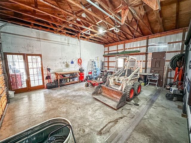 1009 198th Pl, Pella, IA 50219 - garage with a workshop area and french doors