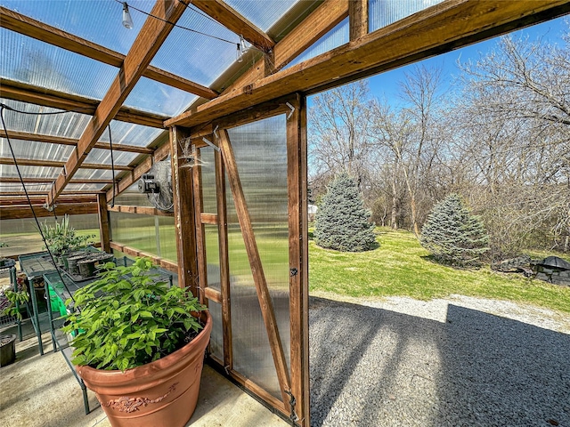 1009 198th Pl, Pella, IA 50219 - view of patio featuring a greenhouse and an outdoor structure