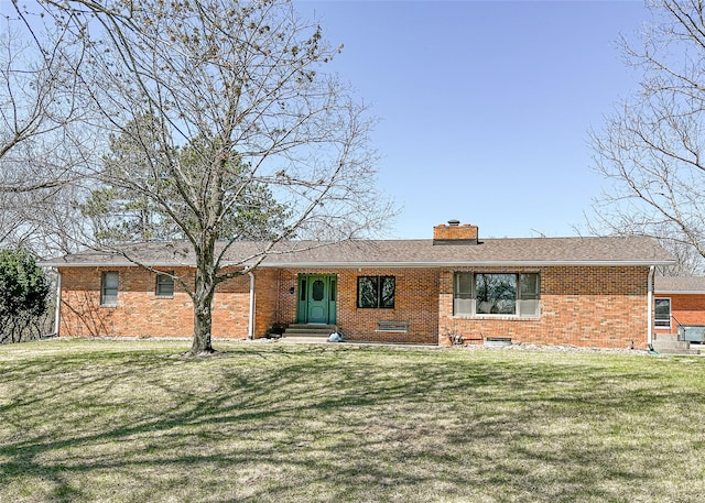 1009 198th Pl, Pella, IA 50219 - single story home with brick siding, a chimney, and a front yard