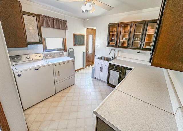 1009 198th Pl, Pella, IA 50219 - laundry area with washer and clothes dryer, light flooring, and ceiling fan