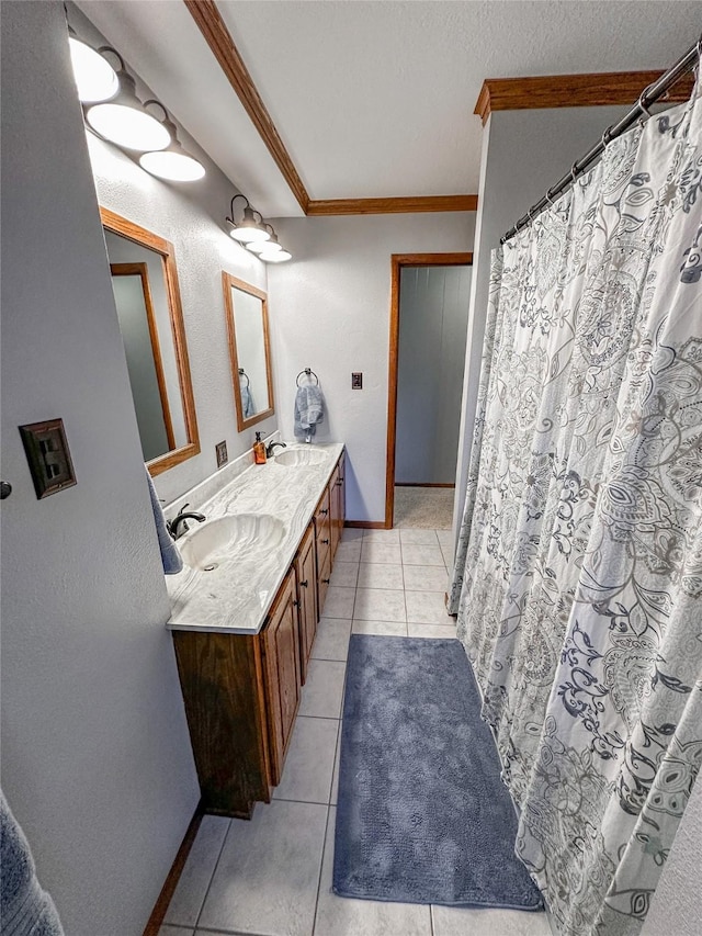 1009 198th Pl, Pella, IA 50219 - full bath with tile patterned flooring, crown molding, double vanity, baseboards, and a shower with shower curtain