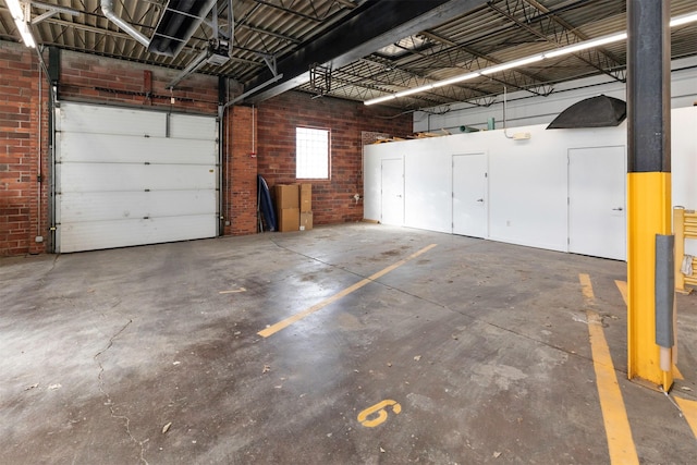 301 E Court Ave Unit 203, Des Moines, IA 50309 - parking deck featuring a garage door opener