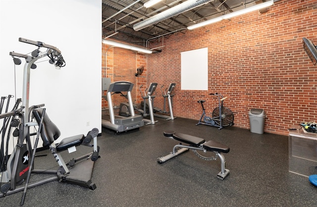 301 E Court Ave Unit 203, Des Moines, IA 50309 - gym with brick wall and a towering ceiling