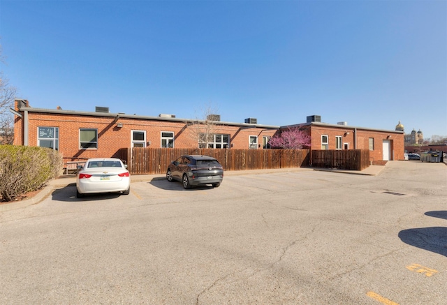 301 E Court Ave Unit 203, Des Moines, IA 50309 - view of front of property with uncovered parking and brick siding
