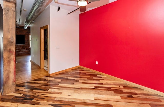 301 E Court Ave Unit 203, Des Moines, IA 50309 - unfurnished room with wood finished floors and ceiling fan
