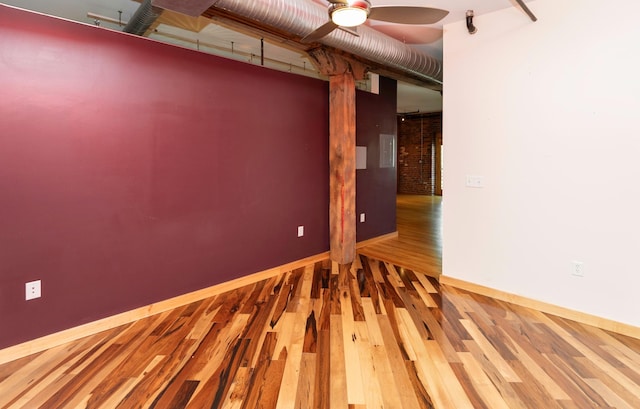 301 E Court Ave Unit 203, Des Moines, IA 50309 - spare room with wood finished floors and a ceiling fan