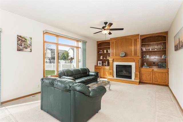 9040 Telford Cir, Johnston, IA 50131 - living area with a ceiling fan, a large fireplace, and baseboards