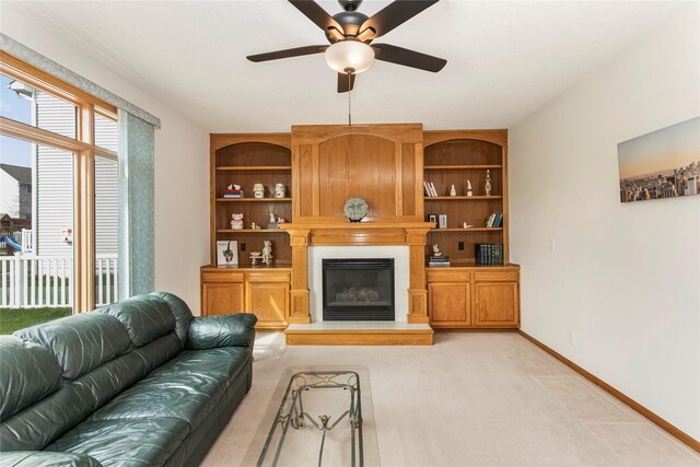 9040 Telford Cir, Johnston, IA 50131 - living room with a ceiling fan, light carpet, a large fireplace, and baseboards