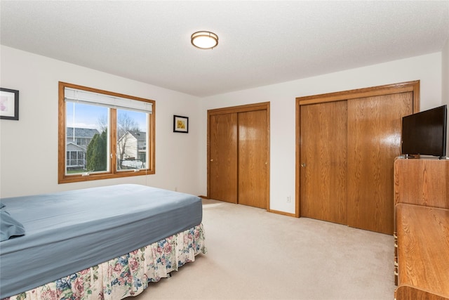 9040 Telford Cir, Johnston, IA 50131 - bedroom with two closets and light colored carpet