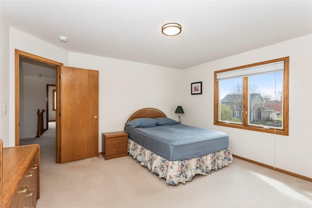 9040 Telford Cir, Johnston, IA 50131 - bedroom featuring light carpet and baseboards
