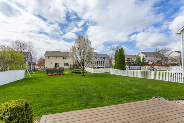 9040 Telford Cir, Johnston, IA 50131 - view of yard featuring a trampoline, a playground, and a residential view