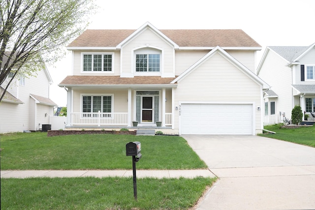 9040 Telford Cir, Johnston, IA 50131 - traditional-style house featuring a porch, driveway, a front yard, a garage, and roof with shingles