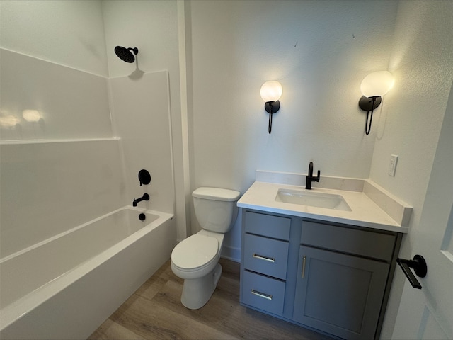 1112 2nd St NE, Altoona, IA 50009 - full bathroom with wood finished floors, vanity, toilet, and shower / tub combination