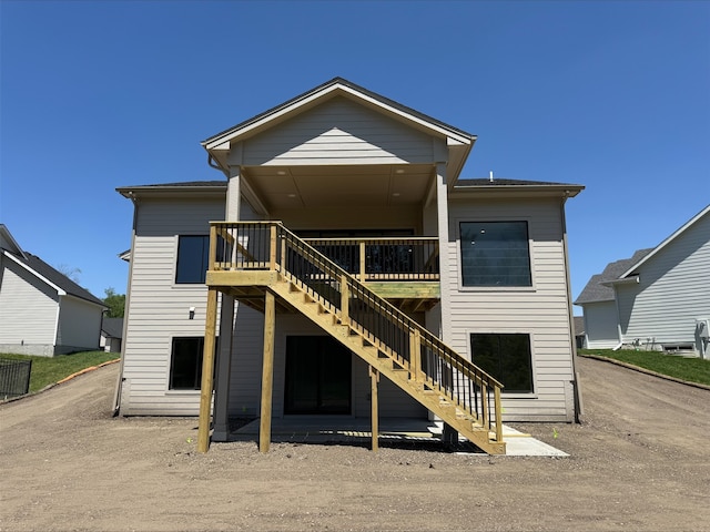 1112 2nd St NE, Altoona, IA 50009 - rear view of house featuring stairs and a wooden deck