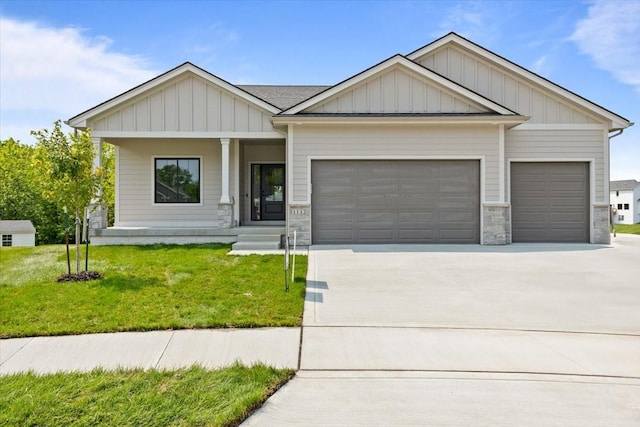 1112 2nd St NE, Altoona, IA 50009 - craftsman house featuring an attached garage, concrete driveway, and a front lawn