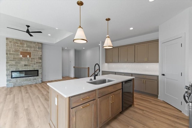 1112 2nd St NE, Altoona, IA 50009 - kitchen with dishwashing machine, a sink, a ceiling fan, light wood finished floors, and recessed lighting