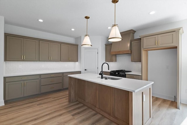 1112 2nd St NE, Altoona, IA 50009 - kitchen featuring a sink, decorative backsplash, light wood finished floors, recessed lighting, and decorative light fixtures