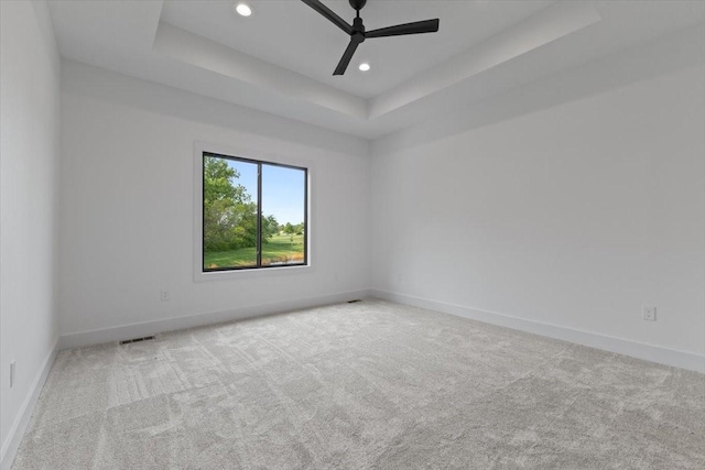 1112 2nd St NE, Altoona, IA 50009 - carpeted empty room with a raised ceiling, baseboards, recessed lighting, and a ceiling fan